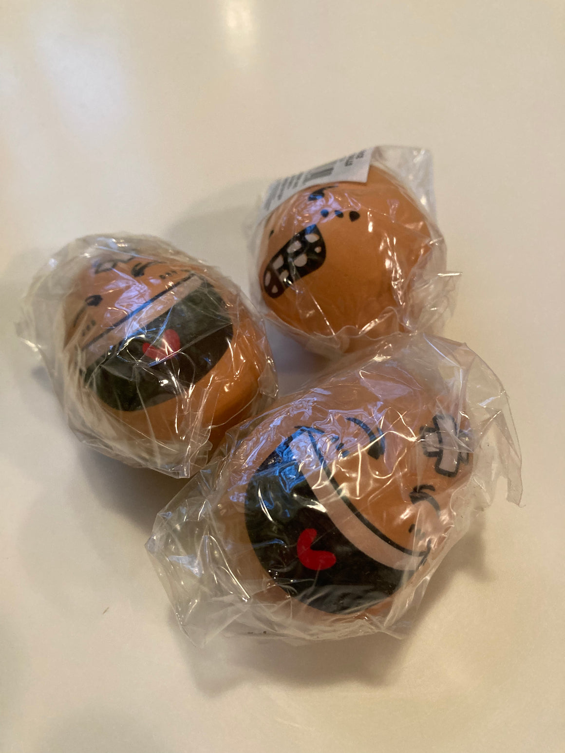 12 Rubber Eggs WITH faces on one side